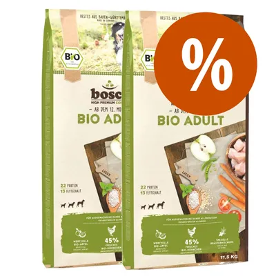 2 sacchi Bosch Bio Adult per cani, 22 proteine, 13% grassi, 45% pollo bio, mele bio, peso visibile 11,5 kg, simbolo percentuale arancione in alto a destra