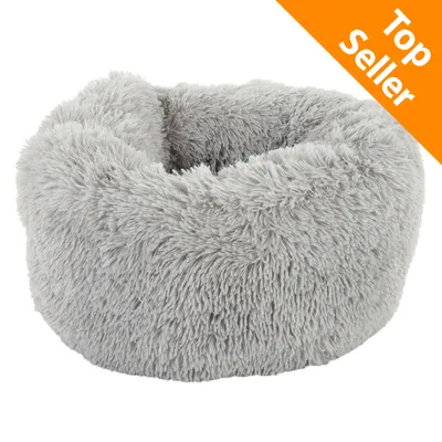 Cuscino rotondo grigio in tessuto peluche, etichetta arancione con testo Top Seller nell'angolo in alto a destra.