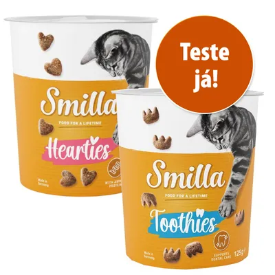 Dois recipientes de snacks para gatos Smilla, variedades Hearties e Toothies, cada um com 125 g. Texto visível: 'Teste já!'. Imagem de gato na embalagem.