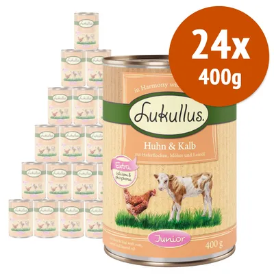 Lukullus Huhn & Kalb Junior, confezione 24x400g. Testo visibile: Extra calcium & phosphorus, mit Haferflocken, Möhre und Leinöl. Immagine di pollo e vitello sulla lattina.