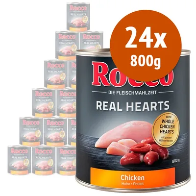 Rocco Real Hearts Chicken, confezione da 24 lattine da 800 g. Testo visibile: 'WITH WHOLE CHICKEN HEARTS', 'Chicken', 'Huhn', 'Poulet'. Immagine di carne e cuori di pollo.