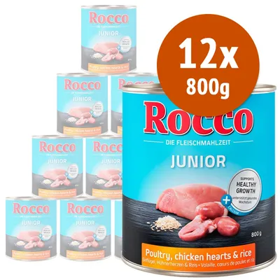 12 lattine da 800 g di Rocco Junior, visibile testo: Poultry, chicken hearts & rice. Immagine di carne e riso sull'etichetta. Testo aggiuntivo in inglese e tedesco.