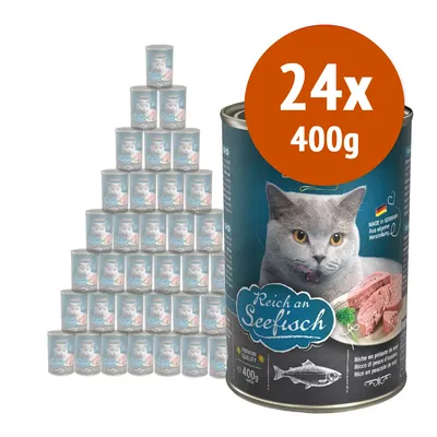 24 lattine da 400 g di cibo per gatti, etichetta con gatto grigio e scritta 'Reich an Seefisch', visibile anche testo 'Ricco di pesce di mare' e bandiera tedesca.