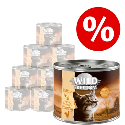 Set conserve Wild Freedom Kitten Wide Country, 100% grain free recipe, imagine cu pisoi și pui pe etichetă, simbol procent roșu pentru promoție.