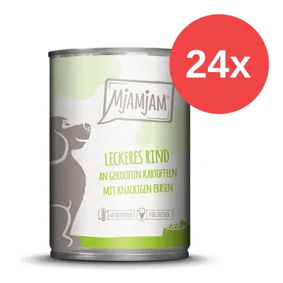 Lata de comida para perros MjAMjAM. Texto visible en alemán: 'Leckeres Rind an gekochten Kartoffeln mit knackigen Erbsen'. Paquete de 24 unidades indicado con círculo rojo y texto '24x'.