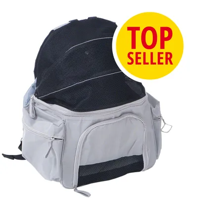 Mochila gris con paneles de malla negra y varios bolsillos con cremalleras. Texto visible: TOP SELLER en círculo amarillo.