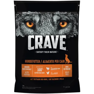 Balení krmiva pro psy CRAVE, nápisy: Satisfy Their Nature, Hundefutter, Hoher Proteingehalt, Hergestellt mit 100% natürlichem Huhn, Mit frischem Huhn, Ohne Getreide, 1 kg