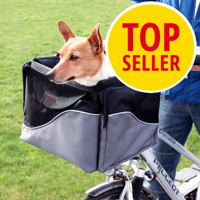 Koira harmaa-mustassa Friends on Tour -pyöräkassissa, kiinnitettynä polkupyörän etuosaan. Keltainen merkki: TOP SELLER.