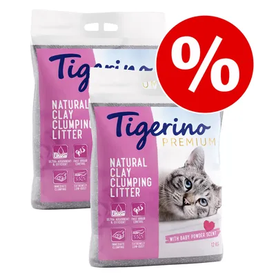 Twee zakken Tigerino Premium Natural Clay Clumping Litter, 12 kg, met baby powder scent. Zichtbare pictogrammen: ultra absorberend, snelle geurbestrijding, directe klontvorming, zeer weinig stof. Kortingssymbool.