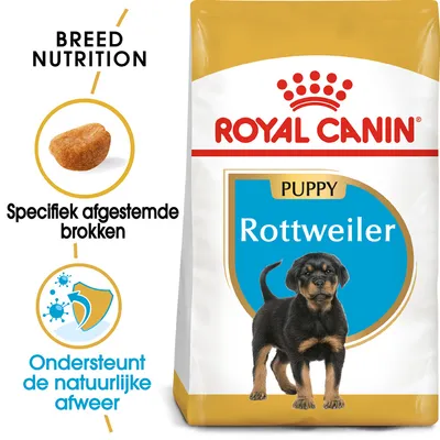 Royal Canin Puppy Rottweiler hondenvoer, specifiek afgestemde brokken, ondersteunt de natuurlijke afweer. Verpakking toont puppy en merknaam.