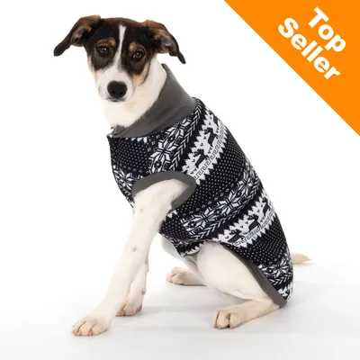 Hund iført sort og hvid striktrøje med snefnug- og rensdyrmønster. Orange hjørnefelt med teksten 'Top Seller' øverst til højre.