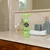 Pet Head Mucky Pup shampoo per cuccioli con profumo di pera, flacone da 300 ml, design verde con tappo a forma di osso.