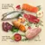 Image showing fresh meat, fish, eggs, fruit, vegetables and herbs with text: 'Lots of meat, fish & selected animal ingredients', 'Great-tasting fruit, vegetables & herbs', 'Grain-free'.