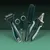Set of grooming tools: dematting comb, scissors, brush and claw cutter in green-black design.