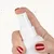 Hand with red nails presses white spray nozzle of a bottle. Close-up of spray mechanism.