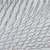 Close-up of metal bristles on a white surface, possibly part of a brush or grooming product.