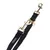 Black dog lead with gold-coloured metal fastenings and pendant, brand label 'Nomad Tales' visible.