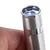 Close-up of a silver laser pointer with blue light, held by a hand.