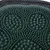 Close-up of a green rubber brush with spiral-shaped nubs, suitable for coat care.