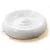 White ceramic pet bowl with raised spiral pattern inside, shown on a light wooden surface. No visible brand or text.