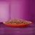 Chunks of wet pet food in gravy served on an orange plate, shown close up to display texture and portion size.