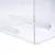 Transparent box made of plexiglass with white plastic rod and rectangular insert. Visible screw at the end of the rod.