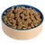 Bowl filled with dry pet food kibble pieces, showing the product’s shape and texture.