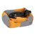 Hund liegt in einem orange-schwarz gestreiften Hundebett mit gepolsterten Seiten und Markenetikett Modern Living.