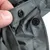 Detailaufnahme von grauem Stoff mit Druckknöpfen, zeigt die Befestigungsmöglichkeit des Materials.