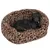 Dog in an oval dog bed with leopard pattern and visible 'Trixie' logo.