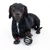Sort hund med en sort bold med Batman-logoet.