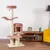 Kratzbaum mit mehreren Ebenen, rosa gepolsterte Liegeflächen und Höhle, Sisalstämme, Holzsockel. Geeignet für Innenräume, modernes Design.