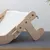 Wooden frame with white fabric cover, suitable for pet furniture or accessories. Visible screws and metal brackets.