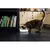 Cat eating from an automatic feeder placed on a kitchen floor, demonstrating product use in a home environment.