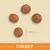 Vier ronde brokjes, diameter 8,5 mm. Onderin staat de tekst 'TURKEY'.