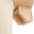 Close-up view of a scratching post element made of light wood and beige sisal fabric.