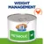 Hill's Prescription Diet Metabolic dog food tin, green label with dog icon, text 'WEIGHT MANAGEMENT' above, chicken symbol shown. Visible product name and branding included.