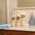 Pet Head Sensitive Soul spray per pelle delicata 300 ml, shampoo 475 ml e balsamo 250 ml al profumo di cocco su mensola del bagno.