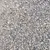 Close-up view of grey and white granules, showing the texture and size of the product material.