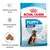 Royal Canin Puppy Maxi 2–15 months. Sistema imunitário forte, desenvolvimento cerebral, tamanho do croquete adaptado. Embalagem com cão e croquetes visíveis.