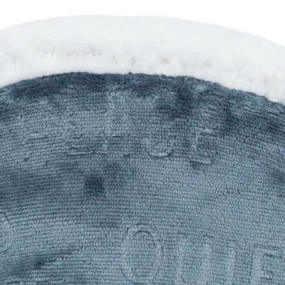 Close-up of a soft blue fabric material with a white edge. Structure and texture of the material are visible.