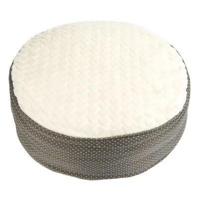 Rund, polstret pude med hvid overside og gråt stofbetræk med små prikker. Velegnet som sidde- eller liggeflade.