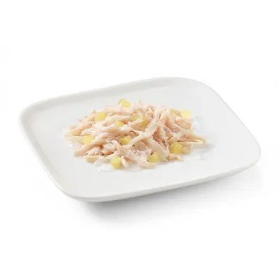 Close-up of shredded chicken meat with yellow pieces on a white plate, presented as product image.