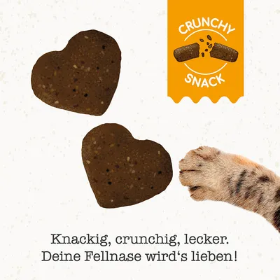 Herzförmige Crunchy Snacks mit Text: Knackig, crunchig, lecker. Deine Fellnase wird's lieben! Orange Label mit Schriftzug 'Crunchy Snack'.