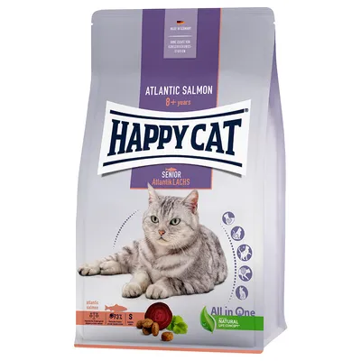 Pienso para gatos Happy Cat Senior Atlantik Lachs, Atlantic Salmon 8+ years. Imagen de un gato gris, iconos de beneficios y texto: All in One, Natural Life Concept, proteína 31 %, grasa 15 %.