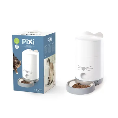 Catit Pixi Smart Futterautomat, weiss, mit Katzengesicht-Design und grauer Futterschale. Verpackung zeigt Produktbild und Katze beim Fressen.
