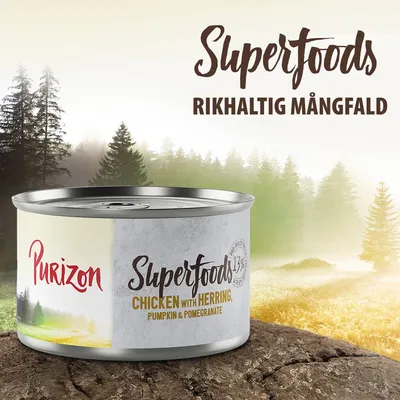 Purizon Superfoods Chicken with Herring, Pumpkin & Pomegranate. Text: Superfoods, Rikhaltig mångfald. 173 g burk synlig.