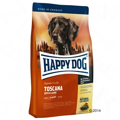 Saco de pienso para perros Happy Dog Supreme Sensible Toscana, visible texto: 'ENTE & LACHS', 'Adult', 'Made in Germany', 'Natural Life Concept'. Imagen de un perro en el envase.