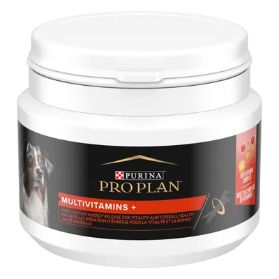 Purina Pro Plan Multivitamins+ tub with dog image, label text: 'Helps sustain energy release for vitality and overall health', 'With vitamin complex', white plastic container with screw lid.