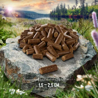 Купчина кафяви гранули върху камък, показани с линия за размер и надпис: 1,5–2,5 см